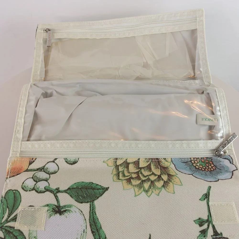 Clinique cream floral print fold over makeup / jewelry bag.
